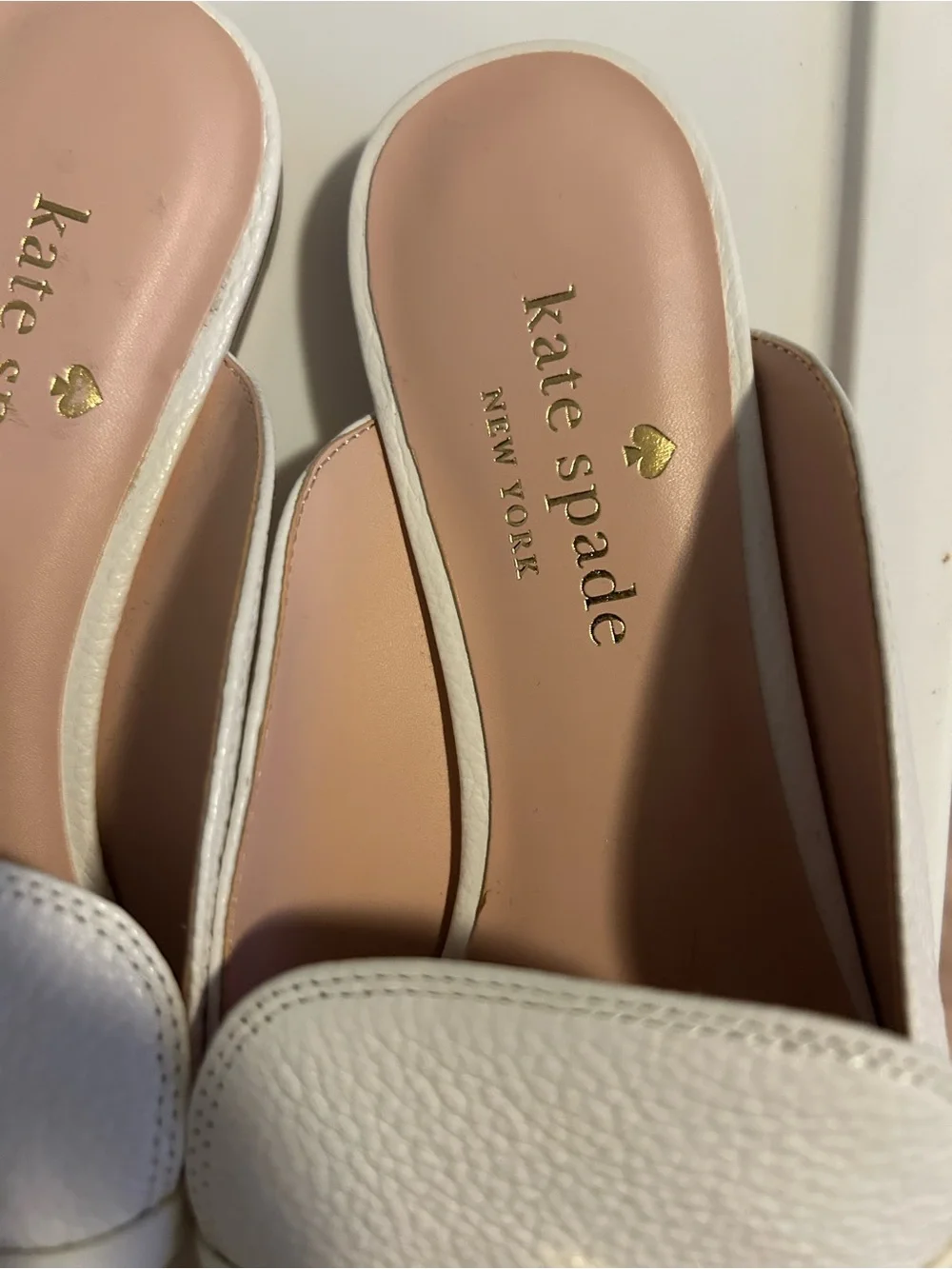 kate spade White Pebbled Leather Backless Loafers with Gold Accent